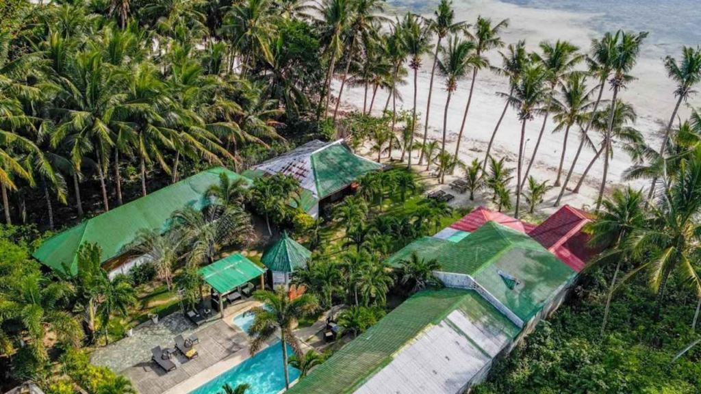 Illustration of a tropical island resort beside turquoise coastal waters at sunset in Siquijor